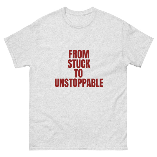 White inspirational shirt with slogan “From Stuck to Unstoppable” – wearable motivation by OrnixMax